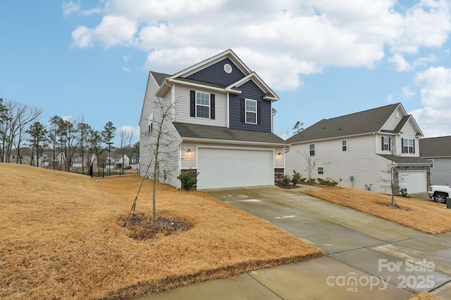 view of front of home featuring a garage and a front yard