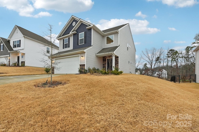 view of front of property with a front yard and a garage