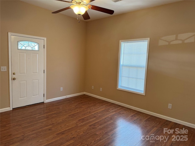 foyer featuring ceiling fan and dark wood-type flooring