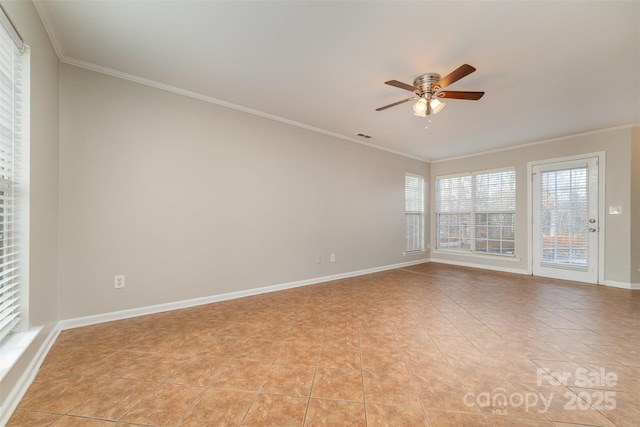 tiled empty room featuring ceiling fan and crown molding