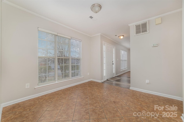 interior space with crown molding and tile patterned floors