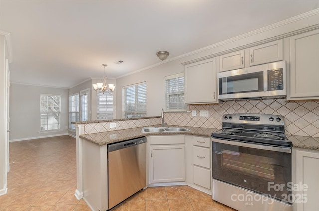 kitchen with stainless steel appliances, light tile patterned floors, a notable chandelier, ornamental molding, and sink