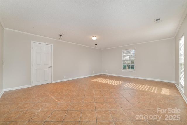 unfurnished room featuring a textured ceiling, light tile patterned flooring, and crown molding