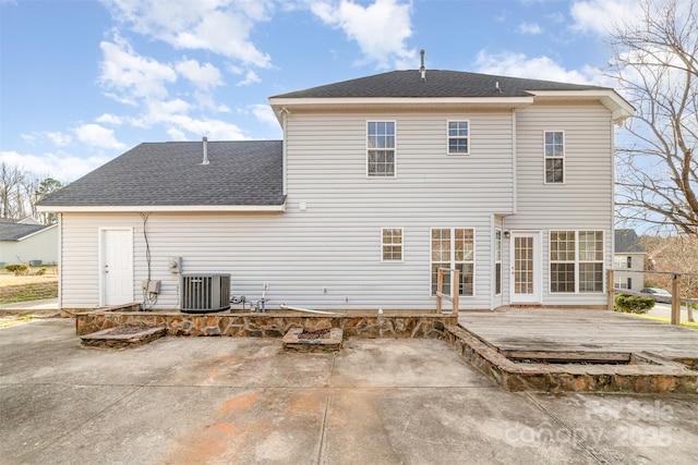 rear view of property featuring a patio, central AC unit, and a deck