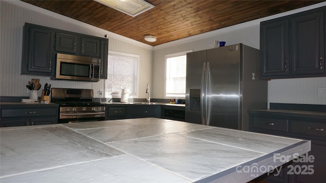 kitchen with wood ceiling, sink, stainless steel appliances, and ornamental molding