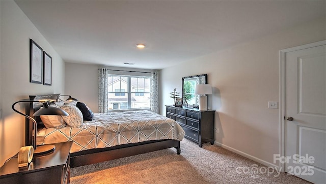 carpeted bedroom with baseboards