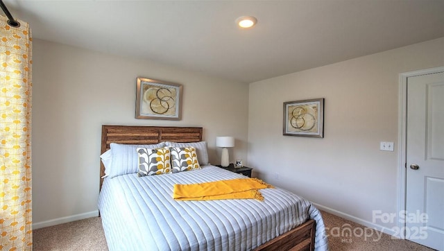 bedroom with carpet and baseboards