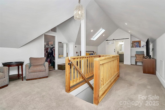 bonus room featuring vaulted ceiling with skylight, light carpet, and an inviting chandelier