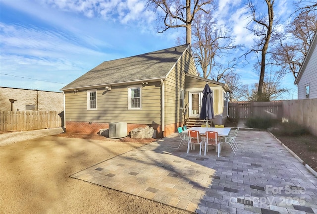 rear view of property featuring central air condition unit and a patio