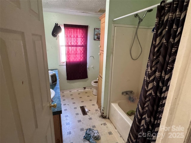 full bathroom featuring vanity, toilet, shower / bathtub combination with curtain, and a textured ceiling