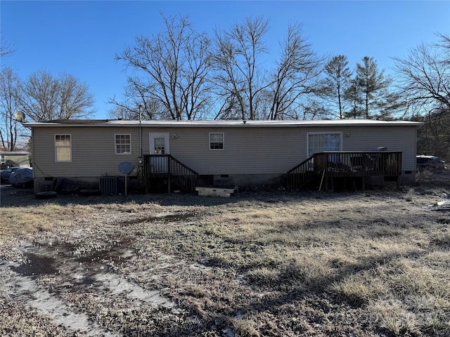 rear view of house with a wooden deck