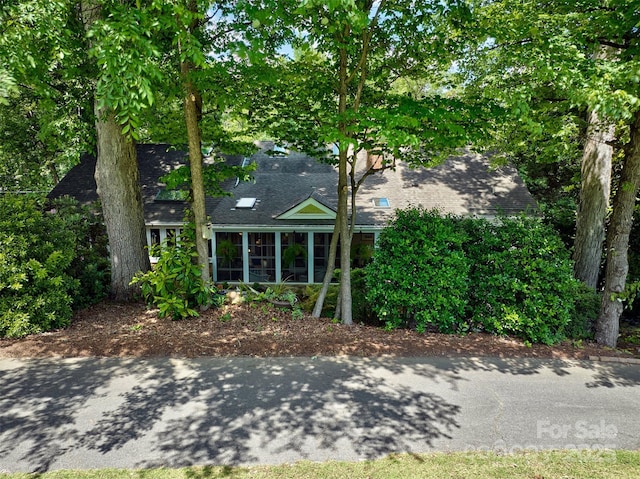 92 Heritage Dr, Clover, SC 29710 - obstructed view of property with a sunroom and a shingled roof