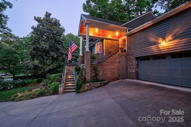92 Heritage Dr, Clover, SC 29710 - view of home's exterior with brick siding, a garage, concrete driveway, and stairway