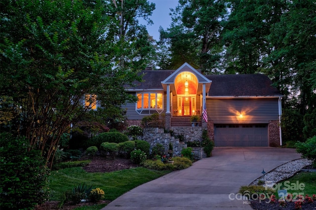 92 Heritage Dr, Clover, SC 29710 - view of front facade with an attached garage, a shingled roof, a chimney, and concrete driveway