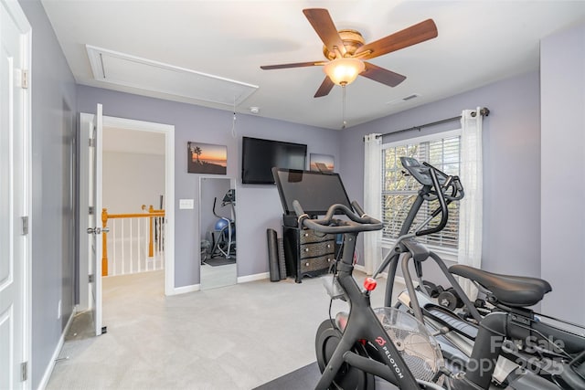 exercise room featuring light carpet and ceiling fan