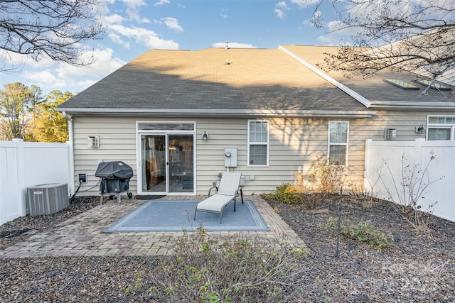 back of house with cooling unit and a patio area