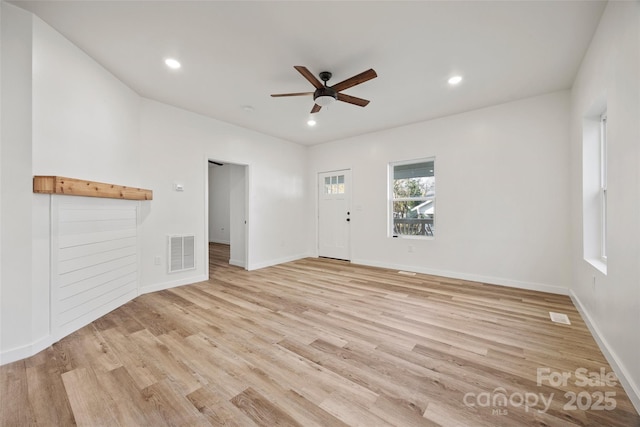 unfurnished living room with light hardwood / wood-style floors and ceiling fan