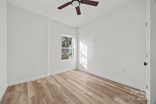 spare room with ceiling fan and light hardwood / wood-style flooring