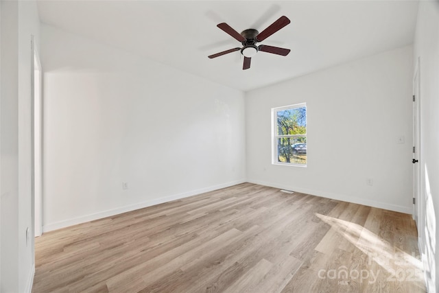 unfurnished room with ceiling fan and light wood-type flooring