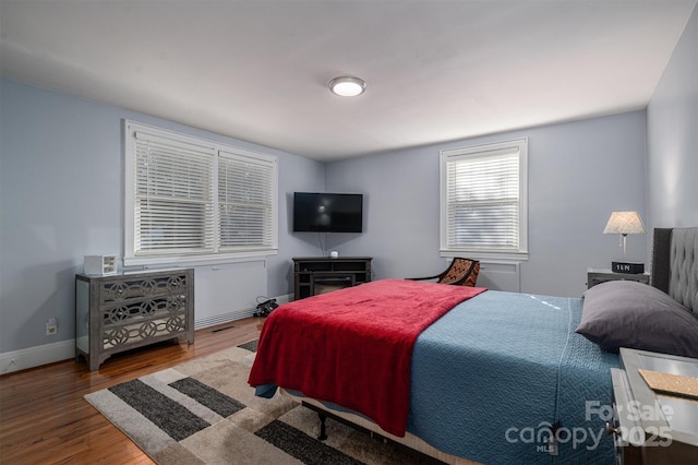 bedroom featuring hardwood / wood-style flooring