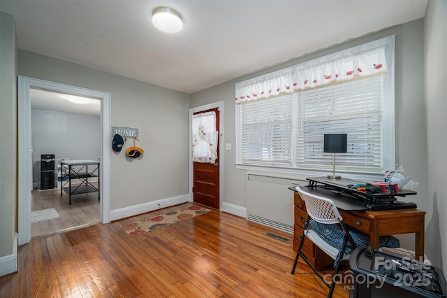 office space featuring hardwood / wood-style floors