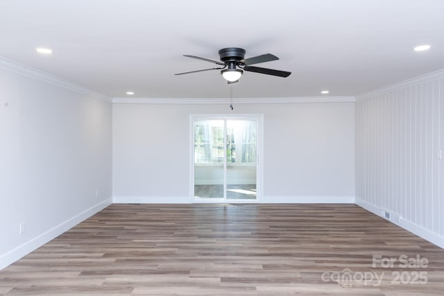 spare room featuring crown molding, ceiling fan, and light hardwood / wood-style flooring