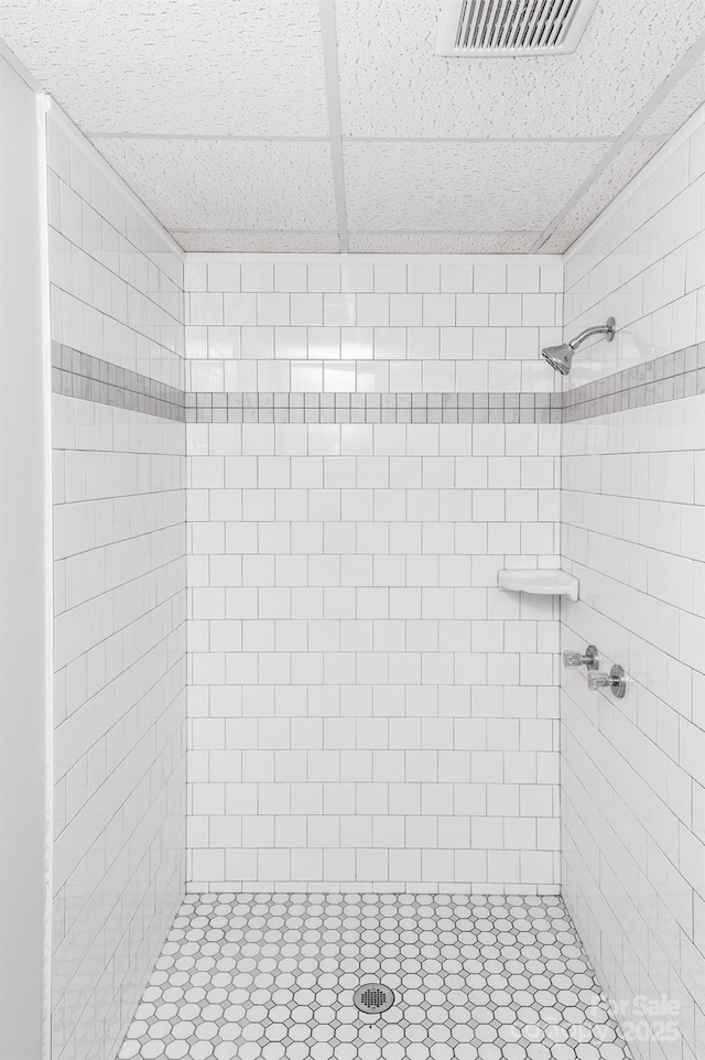 bathroom with a tile shower