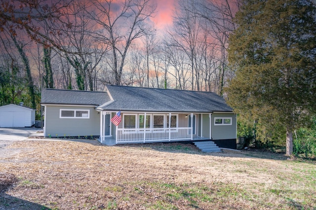 ranch-style house with covered porch