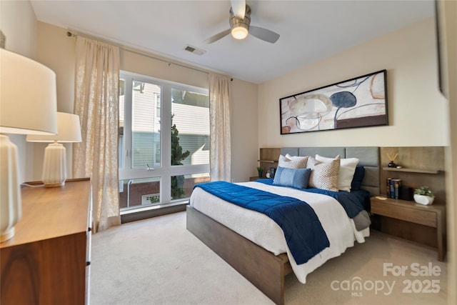 carpeted bedroom featuring ceiling fan