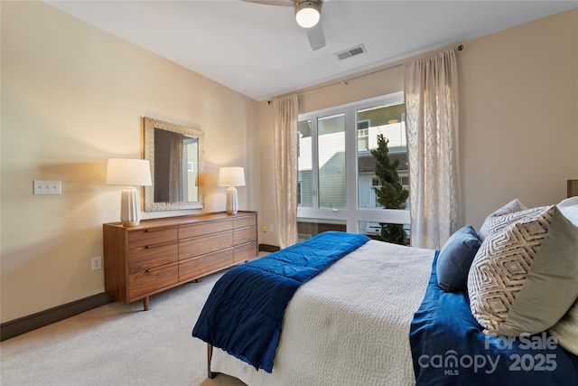 bedroom with ceiling fan and light colored carpet