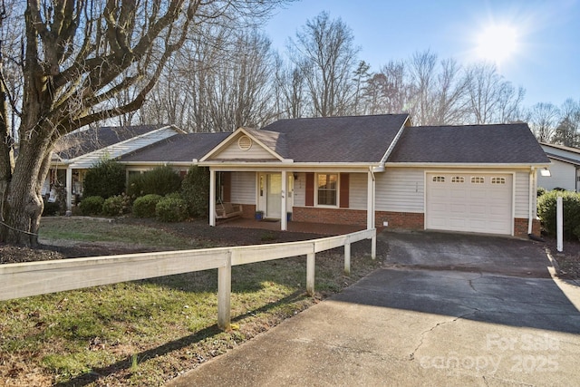 single story home featuring covered porch and a garage