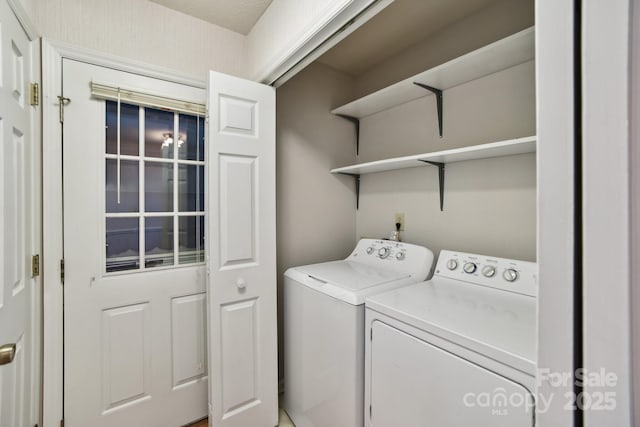 laundry area with independent washer and dryer