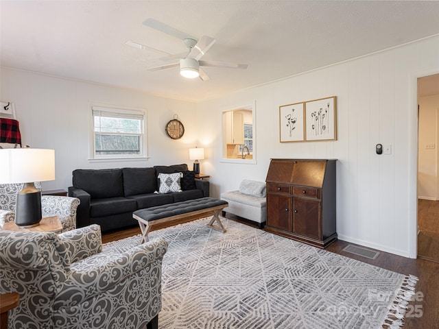 living room with ceiling fan and hardwood / wood-style flooring