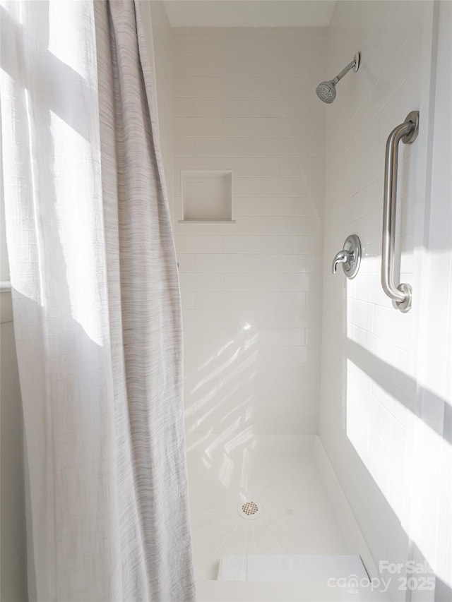 bathroom featuring a shower with curtain