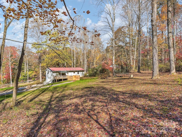 view of yard featuring a wooden deck