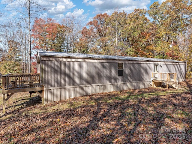 view of property exterior featuring a deck