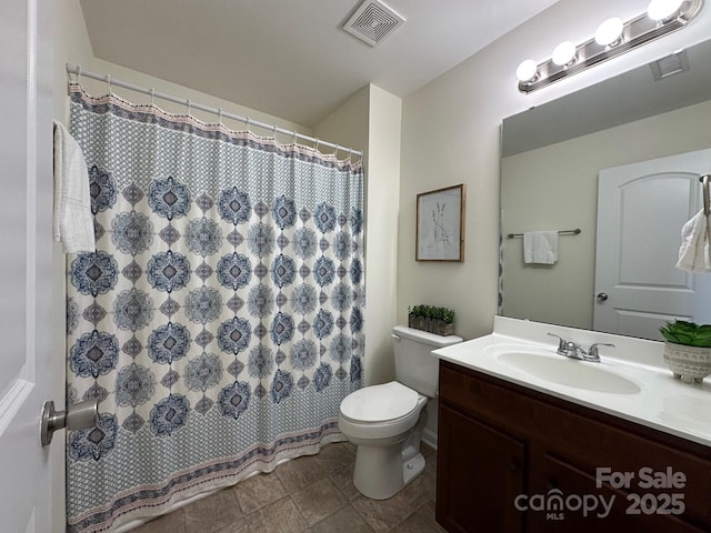 bathroom with a shower with curtain, vanity, and toilet