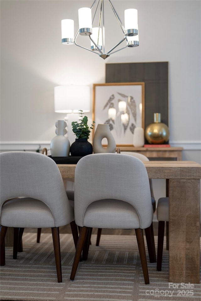 dining room featuring dark colored carpet