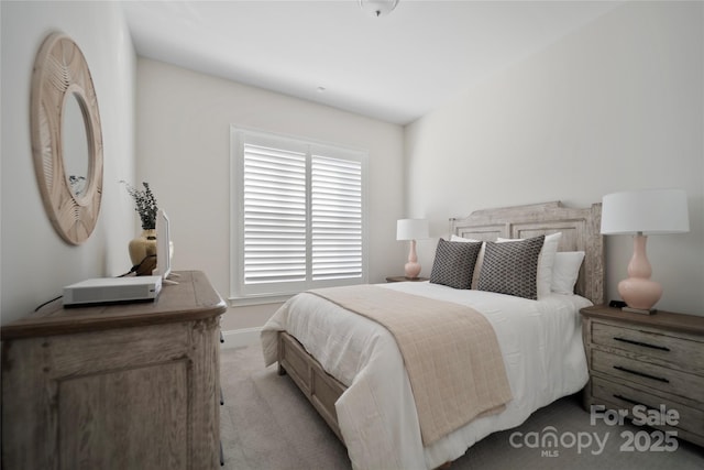 bedroom with light colored carpet