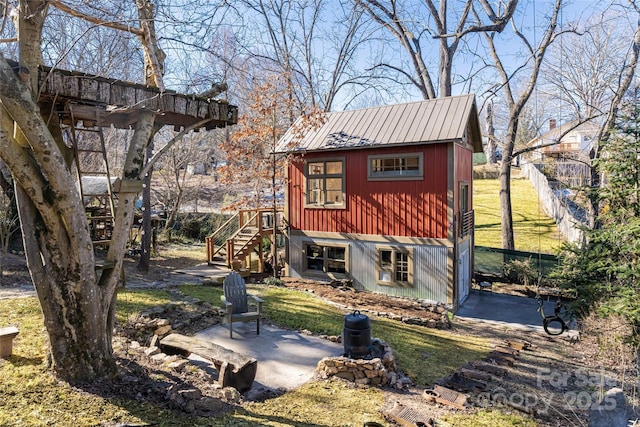 rear view of property featuring a patio area