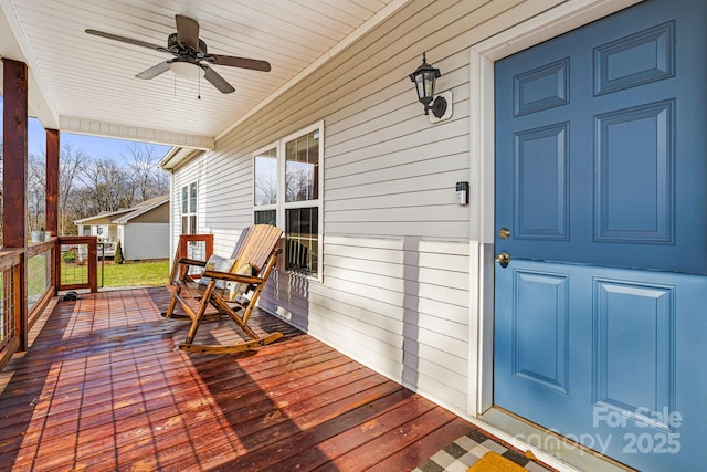 deck featuring ceiling fan and covered porch