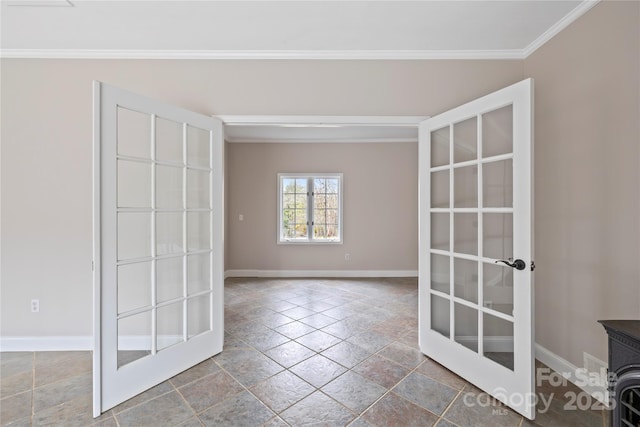 empty room with french doors, baseboards, and ornamental molding