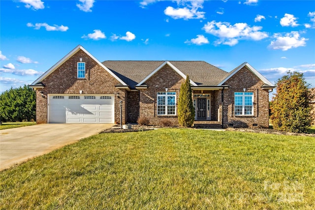 view of front of house with a front yard and a garage