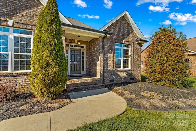 doorway to property featuring covered porch