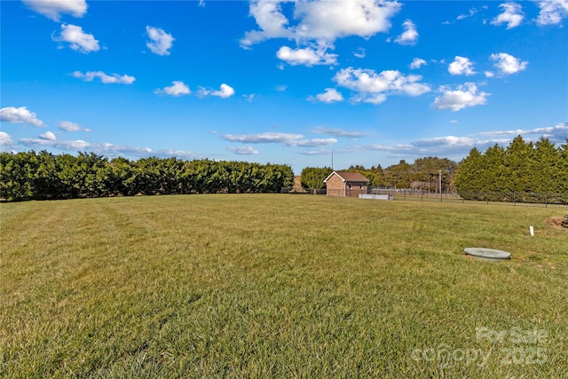 view of yard with a rural view