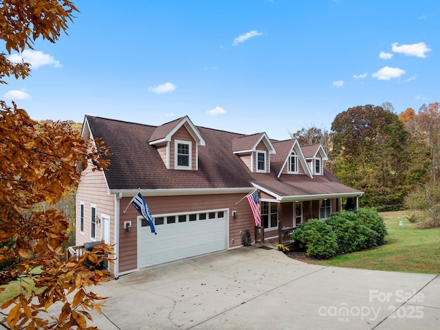 cape cod house with a porch and a garage