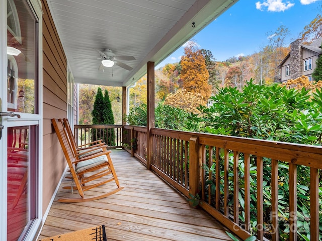 deck featuring ceiling fan and a porch