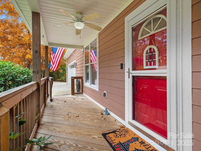 wooden terrace with ceiling fan