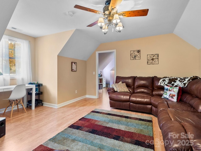 living room with vaulted ceiling, light hardwood / wood-style flooring, and ceiling fan