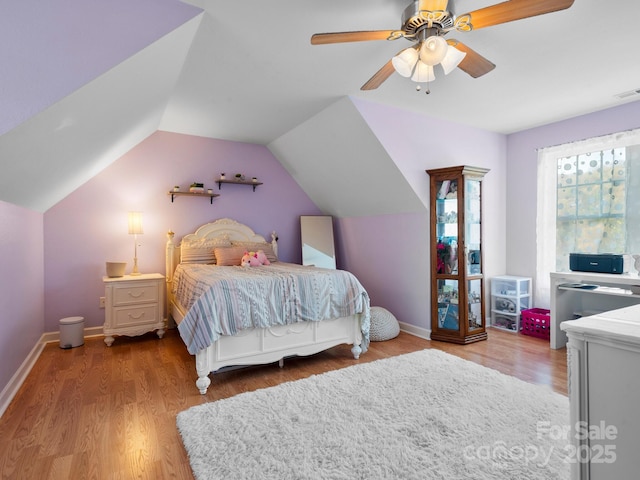 bedroom featuring wood-type flooring, ceiling fan, and lofted ceiling